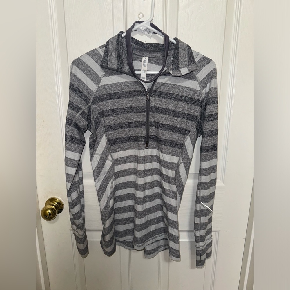 Grey, and white stripped quarter zip. Also, added is a lululemon headband.